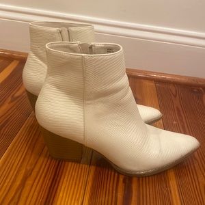 Heeled white booties